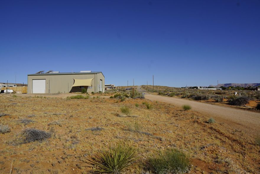 Strong Hwy 89 exposure with turn lanes for easy access - prime commercial opportunity offers .51 acres, ideal for tourism venture.  Located 1/2 block E of the Visitor Center, the property benefits from steady tourist traffic for Lake Powell recreation area, Amangari Resort, Grand Staircase-Escalante Monument, and numerous nearby national parks and attractions.  This area is known for its outdoor recreation, boating, hiking, off-road adventures, and stunning desert scenery.  
Opportunity with exceptional long term potential to establish a business presence in a high-traffic tourism market here on one of S. Utah's most desirable recreation corridors.  
The Seller is willing to look at Seller financing terms!  Water is located in the street and the power is 1/2 block west.  Neighboring tour company is running off grid for their power so there are options for start up costs.  Priced to Sell!