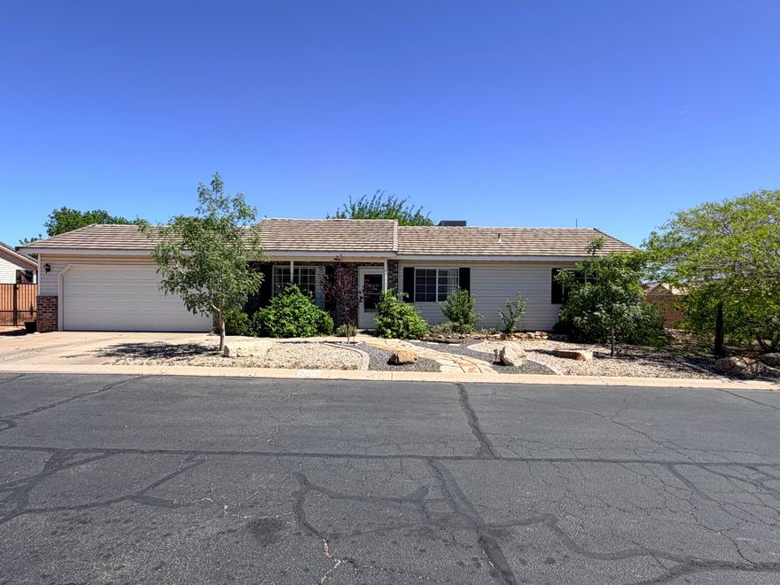 This rare 3-bed/2-bath fully-enclosed property w/ a very private back yard is nestled on a quiet cul-de-sac in desirable Ivins, featuring an inviting flagstone path leading to the front entrance & excellent curb appeal w/ new landscape curbing, decorative rock, & large boulders.  The home offers a 2-car attached garage plus an oversized side parking area - perfect for a motorhome - w/ additional space to build a detached garage up to 22x24.  Inside, you'll find a functional & welcoming floor plan highlighted by an updated kitchen w/ granite countertops, a deep stainless steel sink & faucet, & rich dark wood cabinetry. All new stainless steel appliances are included. Major updates provide peace of mind, including a high-efficiency 2-stage 16 SEER HVAC system installed in 2023 w/ transferrable 10-year warranty. Professionally updated roofing components in 2024. The private, shaded backyard is designed for both relation & entertaining. It features a covered concrete patio, flagstone steps leading to an extended patio area & a separate flagstone fire pit space. There's plenty of room for a pool, trampoline, or activity area. A grass section w/ decorative curbing & a full drip irrigation system ensures easy maintenance. Garden enthusiasts will appreciate the raised garden beds & the variety of mature fruit plants, including peach, nectarine, plum, grapes, pomegranate, blackberries, strawberries, & figs.  Additional highlights include 2 storage sheds (8x8 & 4x6 bike shed) & a large covered patio complete w/ lighting & the option to add a ceiling fan. A natural gas stub on the patio for gill or generator. Deep attic insulation for extra energy savings. Conveniently located just minutes from restaurants, shopping & public transit, & w/in walking distance to parks, trails, & outdoor recreation at Snow Canyon & local reservoirs. Enjoy quick access to nearby scenic attractions & entertainment at world-renowned Tuacahn & Black Desert Resort.