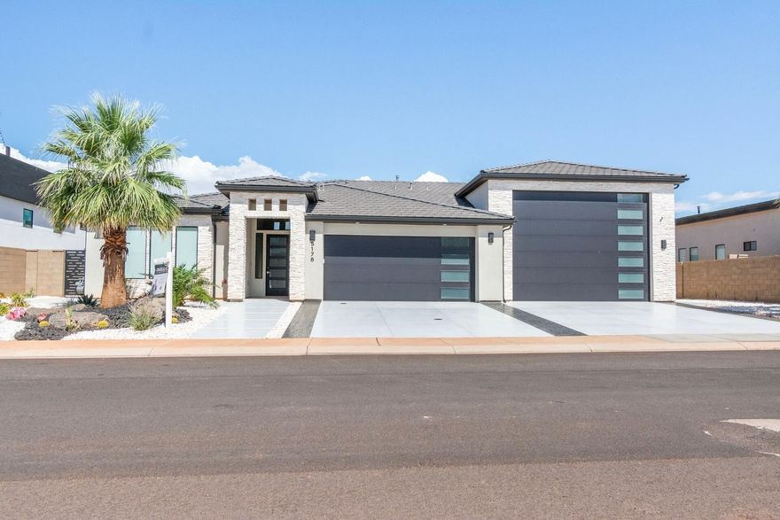 Amazing contemporary single family home built by Artisan Homes in Pecan Valley, just minutes from Sand Hollow. Shows like new! Beautifully upgraded with tile throughout, great room opens to the covered patio and fully fenced backyard. This is a ''TRUE RV Garage'' with 60' x 20' bay and a 14 feet door allows for easy access in and walking space around your toys. The garage is fully insulated and features a garage sink, RV hookups and RV washout, dual split heat and air to enjoy year round while playing with all those toys. Additional features includes sealed concrete drive and walk, security camera system, Sonos sound system, Sony Bravia QLED tvs and soundboard in owner's suite and great room.  Call agent for seller financing terms.