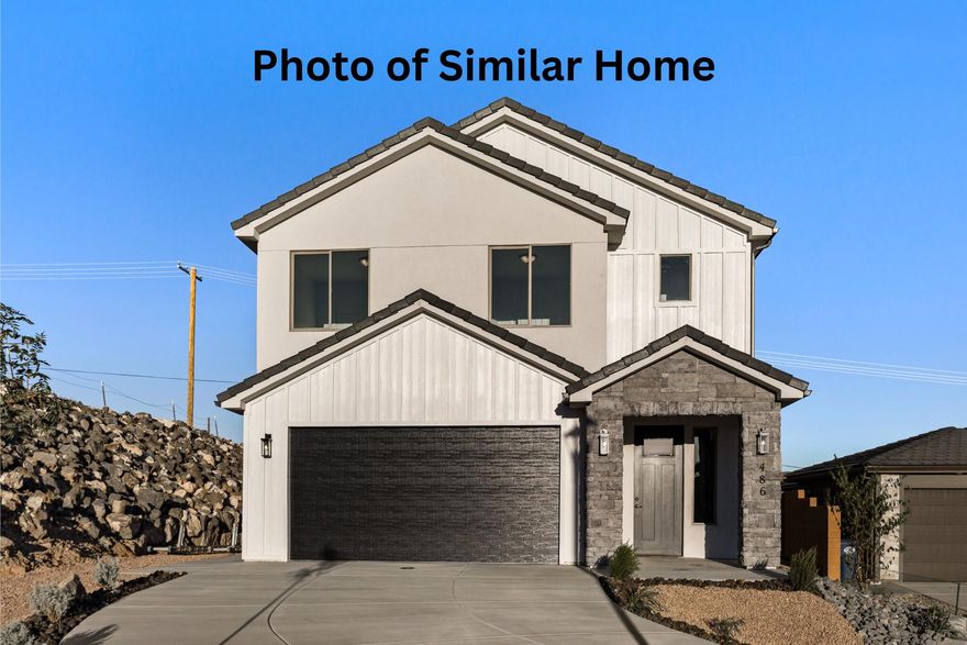 This TO BE BUILT home is in a sweet location, nestled next to a lava cliff side. The floor plan is designed perfectly to maximize the lot. Will be built with the following upgrades: hard flooring throughout the main level, kitchen backsplash, accent laundry tile, tile surround in showers, carpenter accent wall and more. Buyer to have the opportunity to customize selections from builders current selections. Give us a call today! HOA covers subdivision open space.