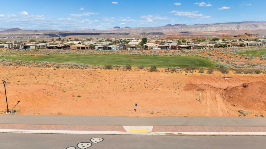 A golf course homesite with rare walk-out basement potential. Lot 8 is one of the most versatile golf course homesites available at The Estates at Sand Hollow Resort. Sitting directly on the Championship Course, one of Golfweek's Top 50 Resort Courses in the United States, this half-acre lot offers something few others in the community can: the topography to support a walk-out basement, opening the door to a lower-level living space, home theater, gym, or guest suite that flows directly to the outdoors.

At 0.51 acres, the lot provides ample space for an estate-style residence, resort pool, and oversized garages, all with direct fairway views as the backdrop. The Estates has hosted multiple Parade of Homes events with showcase homes selling to buyers who recognize this as Southern Utah's premier address. A new regional hospital, new Hurricane schools, and two destination resort developments with water parks are all underway nearby.

Directly across the street, Sand Hollow State Park offers reservoir boating and a sandy beach within minutes. Zion National Park is under an hour. Brian Head Ski Resort and Lake Powell are within easy reach. Ownership includes 40% off Championship Course green fees, discounts on The Links, The Grille, the Pro Shop, and 10% off Mad Moose UTV rentals. HOA covers front and backyard landscaping and hourly security patrol.

Premier approved builders available or bring your own. 15 minutes to St. George Airport. 90 minutes to Las Vegas.