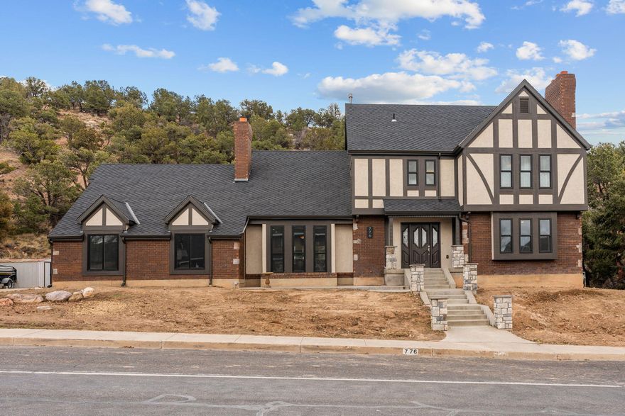 Wonderful one of a kind Tudor in Fiddlers Canyon! This is a perfect family home offering 5 nice sized bedrooms, and 2.5 baths, with a 2 car garage! The homes exterior was updated in 2024, and looks absolutely pristine including a 40 year roof, and heavy duty double hung windows. The kitchen and upstairs baths were just updated in 2026 making this 
home move in ready! A gorgeous gas fireplace in the living room, and wood burning fireplace in the main floor family room make all your gatherings feel warm and inviting. French doors lead out to the covered patio and secluded lot covered with natural trees. The yard is ready for customization. Large 2nd family room in the basement has built in storage, and a Dolby Atmos Home Theater System with 9 built in speakers and projector w/ 120'' screen. Home has permanent holiday lighting, a water filtration system, 2 water heaters, and a large storage room in the basement. The garage has a workshop/man cave with power and heat (or it could be ATV storage) 
Don't miss out on this wonderful home! Come take a look today!