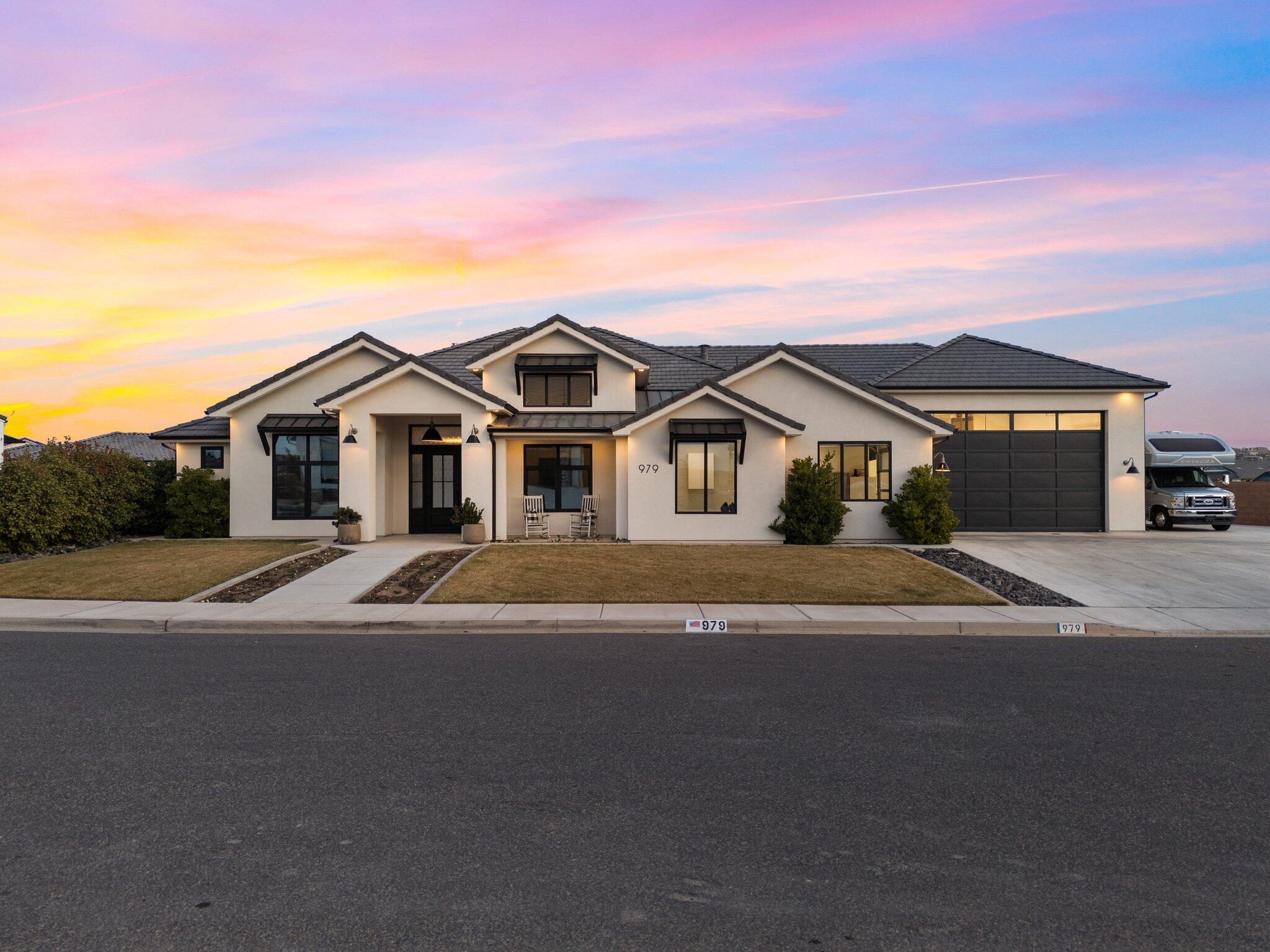 High End Finishes throughout this  Custom Home.

RV Door: 18'w x12' high
Garage 25w30d.

This 3,473 sq. ft. home offers luxury and comfort on a .40-acre lot. Features include a chef's kitchen with Thermador appliances, quartz counters, and a large butler's pantry. High ceilings, wood floors, and expansive windows create a bright, open feel. 

Large 2nd Family Rm/Sewing/Bunk/Bedroom/Theater Room That really takes this home to the next level.

2 Master Suites. The primary suite boasts a spa-like bath, massive walk in closet, and custom cabinetry. Outdoor paradise with a pool, integrated hot tub, fire pit, and sports court. Oversized 3-car garage, and RV parking. Gemstone permanent lighting.  New, Quiet Neighborhood close to everything.  A must see!

So many extras, see in documen See Documents for Full List.

Interior Features:
	-  Open floor plan with high ceilings, large windows & beautiful wood floors
	-  Chef's kitchen: Thermador gas appliances, quartz waterfall island, custom cabinets, butler's pantry
	-  Spacious master suite: spa-like bath with soaking tub, body spray shower, dual quartz vanities, custom walk in close with built-ins & jewelry storage
	-  Second master suite with walk-in shower & quartz vanity
        -  Large rec room for theater, gym, or game space with private climate control
	-  Home office with built-in cabinets & accent wall

Outdoor Oasis:
	-  Large pool (24'x40') with lights, heater, cover & integrated hot tub
        -  Fire pit with gas line, artificial grass, climbing plant wires
	-  Pickleball/basketball court & cement trike area
	-  Covered patio with three exterior doors, remote blinds & sliding wall for seamless indoor-outdoor flow
	-  Smart sprinkler & landscape lighting systems

Additional Features:
	-  Oversized 3-car garage with epoxy floors & RV parking
	-  Gemstone permanent exterior lighting
	-  All-block walls, tile roof, and high-end black-framed windows with retractable screens