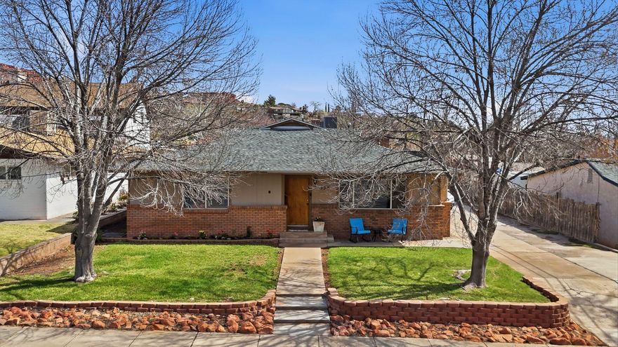 Located just off Diagonal Street in the heart of downtown St. George, this unique property offers an unbeatable combination of charm, location, and investment potential. Within walking distance to parks, shopping, restaurants, and other downtown amenities, the location provides both convenience and lifestyle appeal.

Originally built in 1951, the home has been thoughtfully expanded over the years with the addition of a spacious primary bedroom and large living room, bringing the total living space to approximately 2,310 square feet. The home features large bedrooms, two cozy wood-burning stoves, and a warm brick exterior that adds character and durability. Recent updates include improvements to the plumbing, an updated bathroom, and a newer HVAC system, providing comfort and peace of mind.

What truly sets this property apart is the impressive 0.40-acre lot, an extremely rare find this close to downtown St. George. Mature trees provide shade and privacy, while the large driveway offers plenty of parking for residents, guests, or tenants. The property also includes a detached shop or one-car garage, perfect for storage, hobbies, or workspace.

For investors or those looking to maximize value, the property presents exceptional opportunity. According to city allowances, up to two Accessory Dwelling Units (ADUs) may be permitted on the property, creating the potential for multiple rental streams or multigenerational living. With the generous lot size and flexible layout, there are many possibilities to expand the property's income potential.

Whether you're looking for a unique downtown residence with space to grow, an investment property with strong rental potential, or a rare large lot in a highly desirable location, this St. George property offers opportunities that are increasingly hard to find.