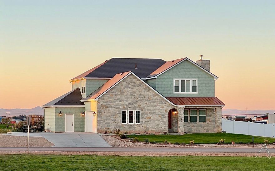 A charming home that's big enough for everyone but cozy enough just for you. 
Set in a peaceful country neighborhood, the highly sought after Estates at Sunrise Ranch is conveniently located only 10 minutes from town and embodies a strong sense of community, while maintaining space and privacy. 

Enjoy sitting on the stone-wrapped front porch, captivated by a beautiful mountain view of Cedar Canyon or greet the sunrise on the back deck looking out to a picturesque country scene. Plenty of space to build a shop, raise animals, plant a large garden or all the above. 

Step into this timeless custom home where classic design and traditional craftsmanship meets modern functionality and convenience. The warm neutral colors, as seen in the elegant oak hardwood floors, brass fixtures and marble-look quartz, provide a flexible palette for any taste and decorating style.

The purposeful layout delivers an expansive open-concept main floor for entertaining while the primary suite, home office and 3 additional bedrooms are privately sequestered on the 2nd floor. Enjoy the large designer kitchen with an over 8-foot island. And nestled in the west wing of the main floor, is a guest bedroom next to a full bathroom, ideal for multigenerational living, or recreation.
 
If the 3,200 square feet above ground isn't enough, the 1,600 square foot basement is 75% finished, with a large storage room, ample living area, an additional bedroom and a future full bathroom. 

Behind the aesthetics, this house boasts superior energy efficiency and comfort with an aluminum shingle 100-year roof, insulated interior walls and 2 HVAC systems. Also enjoy fiber internet and exterior camera connections throughout. And breathe easy with many healthy home materials and finishes.

These upgrades and more significantly improve the durability, comfort and quality of living within the home. Ask for the full list of features and schedule a showing.