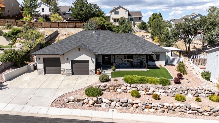 Welcome to this beautiful 2,169 sq. ft. home situated on a quarter-acre lot, offering 3 bedrooms and 2 bathrooms with a spacious open floor plan and 9-foot ceilings throughout. Designed for both comfort and convenience, the home features wide hallways and doors, along with open layouts in the kitchen, bathrooms, and throughout—providing easy accessibility for a walker and effortless movement of furniture. A large pantry, oversized closets in every room, and stunning mountain views add to the thoughtful design. The master suite serves as a true retreat with a double vanity, separate shower and tub, and a walk-in closet. Upgrades and features include an oversized, tall 2-car garage with ample storage space, Kinetico water softener & reverse osmosis system, skylights in the entry and kitchen, a Hale dog door, and a storm door at the front entry. Additional conveniences include a side yard exit door from the office and a private backyard patio perfect for relaxing or entertaining. The exterior is fully landscaped with fencing, AstroTurf, and an awning, while the covered front porch adds inviting curb appeal. This home combines modern upgrades, functional living spaces, and accessibilitymaking it a rare opportunity you won't want to miss. Some appliances, furniture, and even the hot tub may be negotiable with an acceptable offer.