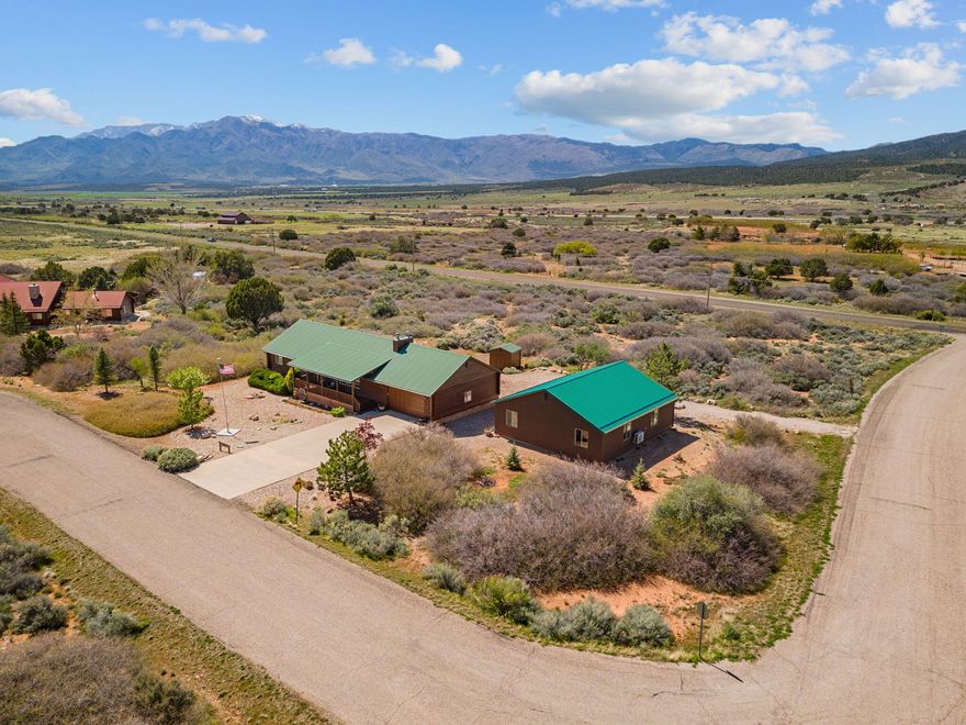 This is a one of a kind home in Chekshani Cliffs with over an acre of property. This home has a lot of extras you need to see to
appreciate. A few of the great things is the 1600 square foot heated and cooled shop, the large theater room, and the 1950s soda shop room. Recently
the logs have been all treated along with the decks. Don't hesitate to book your showing.