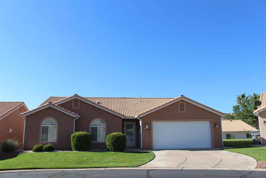 Charming Fully-Furnished 3-Bedroom, 2-Bath Home with Two-Car Garage in the Scenic Santa Fe at Red Cliffs senior 55+ Community
This beautifully maintained and fully furnished home offers a perfect blend of comfort and style, featuring 3 spacious bedrooms, 2 well-appointed bathrooms, and a two-car garage. It comes complete with modern amenities, including a washer, dryer, and water softener.
Nestled in the tranquil, lush community of Santa Fe at Red Cliffs, residents enjoy access to a wealth of top-tier amenities. The expansive community center boasts a dance floor, library, pool table, fully-equipped exercise room, and a serene indoor heated pool and hot tub, ideal for relaxation or staying active.
Conveniently located near Red Cliffs Mall, medical facilities, a variety of eateries, and shopping centers, walking and biking trails. This home offers both peaceful living and easy access to everything you need.