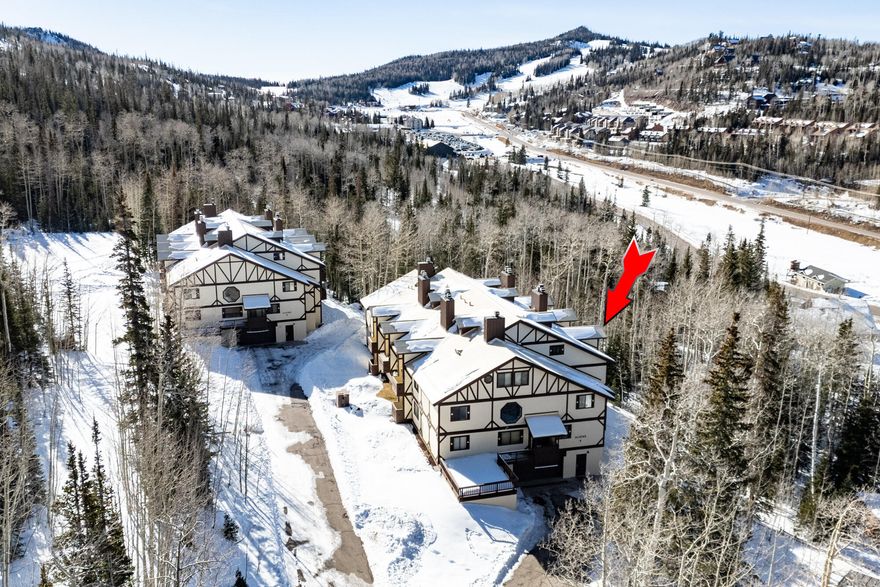 Turnkey condo in the desirable Alpine Condos at Brian Head, surrounded by beautiful aspen trees and offering year-round access just around the corner from Giant Steps Ski Resort. This furnished 1-bedroom plus loft, 2-bath condo features 1,087 sq ft with a warm mountain feel, including vaulted ceilings, large windows, and a cozy wood-burning stove. The main level offers an open kitchen and living area with updated appliances, a full bathroom, and a pool table - perfect for entertaining after a day on the mountain. Upstairs includes a private bedroom, full bathroom, and a loft with bunk beds that can easily be converted into an additional sitting or TV area, or left as is for extra sleeping space. Each unit includes a private exterior gear closet, one underground covered parking space, and convenient access to HOA-provided firewood located in the garage. Owners have access to use the shared laundry facilities in the complex. The complex allows short-term rentals, making this an excellent opportunity for personal use, investment, or both. Enjoy mountain living with easy access to skiing, trails, and all that Brian Head has to offer - all in a peaceful alpine setting.