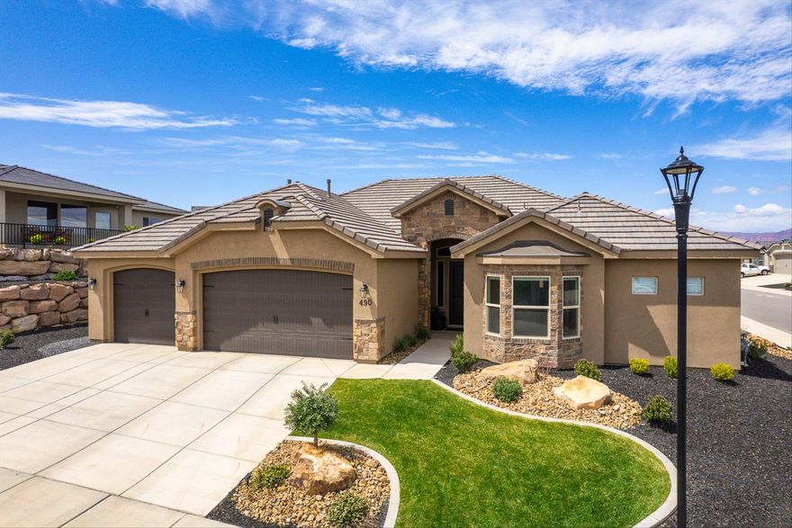 Don't Miss this Exquisitely Designed & practically brand new home in Divario!! Featuring an open concept floor plan that is bright & inviting.  Not to mention the upgrades this home was appointed w/ such as the beautiful, large master suite, wood flooring throughout, 4 walk in closets in each room, upgraded cabinetry & a spacious kitchen w/ granite countertops. The fully landscaped & fenced backyard is perfect for entertaining with additional concrete & privacy! The 3-car garage provides extra depth/width and side parking.  Close to many hiking/biking trails, golf, shopping and so much more.