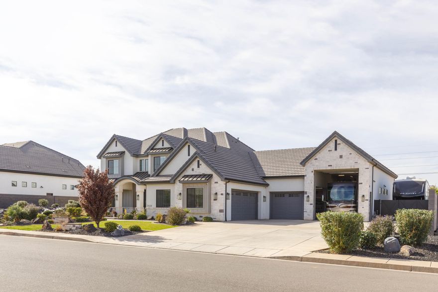 This highly upgraded Queensridge home is perfect for entertaining and family living. The backyard features a pool with slide and waterfall, pool bathroom, firepit and pickleball court. Inside, an open floor plan includes an outstanding kitchen complimented with custom cabinetry, custom lighting controls, large island and walk-in pantry. The primary suite offers patio access, custom closet, walk-in shower, and soaking tub. Bonus room above the garage and a second family room upstairs. Three-car garage plus 60-ft RV garage. Move-in ready with all upgrades complete!