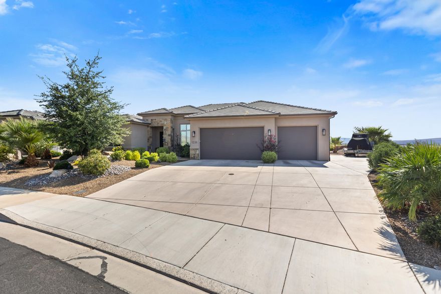 Owner has moved into a new home.  This new price is Spectacular for this home! Live where the views never end! This Green Springs Golf Course gem showcases breathtaking sights of Zion National Park right from your backyard. Step inside to find sleek quartz counters, elegant tile flooring, and high-end finishes that bring modern style to every room. The spacious backyard features brand-new low-maintenance turf, a custom built gas fire pit, a large covered patio for entertaining, and extra side parking for all your toys. This home blends luxury, comfort, and location. Book your showing today!