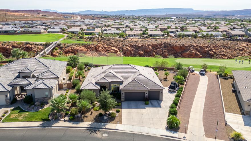 Owner has moved into a new home.  This new price is Spectacular for this home! Live where the views never end! This Green Springs Golf Course gem showcases breathtaking sights of Zion National Park right from your backyard. Step inside to find sleek quartz counters, elegant tile flooring, and high-end finishes that bring modern style to every room. The spacious backyard features brand-new low-maintenance turf, a custom built gas fire pit, a large covered patio for entertaining, and extra side parking for all your toys. This home blends luxury, comfort, and location. Book your showing today!