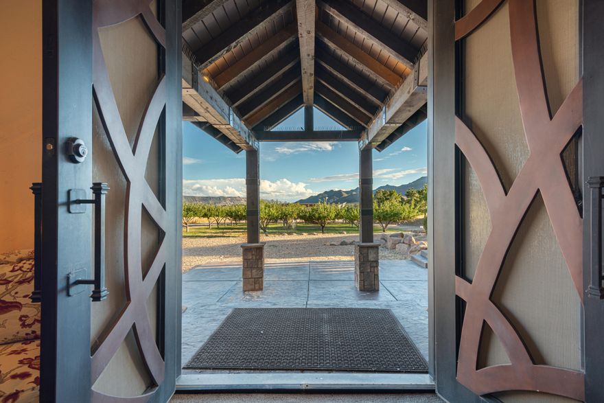 Experience a rare Southern Utah estate where recreational living, privacy, and long‑term land productivity come together. 10-bedroom 5-bathroom estate set on more than 20 irrigated acres, this New Harmony ranch offers two private ponds, a producing orchard, extensive solar infrastructure, and secure water resources, including 20 water shares, a culinary water right, and a 10,000‑gallon freshwater tank.

The 8,762‑sq‑ft residence is designed for year‑round enjoyment with an indoor pool, sports court, multiple gathering spaces, and warm natural materials throughout. Ten bedrooms support flexible living arrangements and effortless hosting. Large windows frame views of Kolob's red rock cliffs, and outdoor spaces invite quiet evenings by the firepit or active day Productive land enhances the property's value with irrigated pastures, orchard harvests, and room for recreation or expansion. Wide open spaces, private ponds, and energysupporting systems create a setting that feels both serene and self-sustaining.

Whether used as a primary residence, private retreat, or multiuse estate, this property offers a rare combination of scale, amenities, and natural beauty that is difficult to replicate anywhere in Southern Utah.