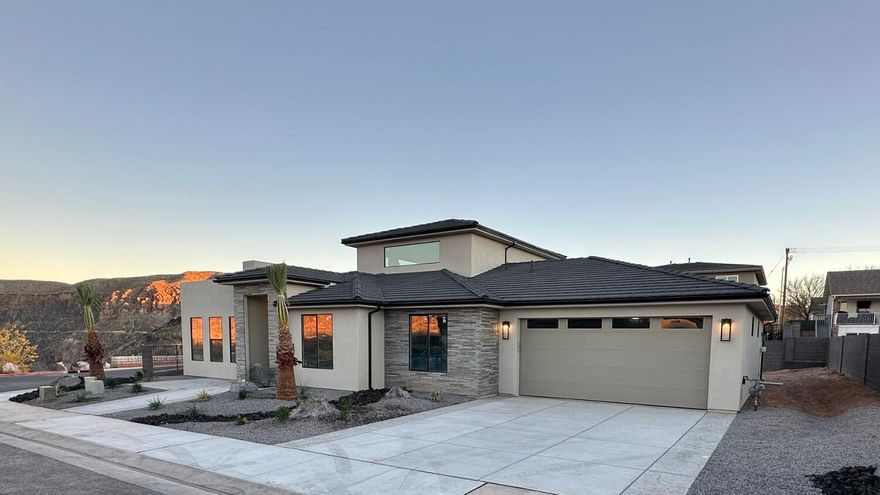 Brand New Home situated on an extra-large, premium view lot-designed for the way you live and play. This beautiful 3 bed, 2 bath Madsen Custom Home features a spacious great room that flows to an outdoor living space under the covered patio.

The upper bonus/rec room opens to another incredible out door space on the rooftop deck - perfect for sunrise coffee or sunset wine while taking in the unsurpassed views. 

Featuring Quartz countertops, Knotty Alder cabinetry, Butler Pantry, Luxury Vinyl Plank flooring and unique tile throughout. The Primary Suite offers an extra long, double vanity, oversized shower and walk-in closet.

Modern finishes, the thoughtful design including the expansive windows bringing in the natural light and  breathtaking views; along with the attention to detail and quality workmanship make this one you definitely don't want to miss!

RV Parking area along with the double-tandem (4-CAR) garage offers room for all the toys. The garage features a second overhead door in the rear for ease of access. The sprawling .27 acre lot give you plenty of room for a future pool and much more!

Centrally located with quick access to all the outdoor adventures Southern Utah has to offer.  Biking, hiking, golfing, UTV riding, boating, fishing and more! .Just 30 minutes away from Zion National Park and St George and 15 minutes from Sand Hollow & Quail Creek Reservoirs. This IS Southern Utah LIVING!