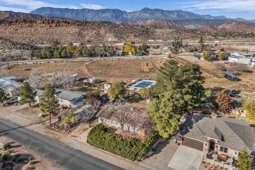 Great opportunity in Leeds! This charming, well-kept 3-bedroom, 1-bath home is tucked away on a larger, secluded, beautifully landscaped lot, offering peaceful surroundings and gorgeous views of Pine Valley Mountain. Unwind on your private patio and enjoy the serenity, privacy, and natural beauty that make this property so special. The cozy, move-in-ready interior feels warm and welcoming, featuring fresh paint, new carpet, and a wood-burning stove that adds both comfort and cost-efficient heating during the cooler months. With no HOA and ample space to expand, this property offers endless potential. Perfect as a starter home, vacation retreat, or investment opportunity, this inviting Leeds gem won't last long, so schedule your showing today! Buyer to verify all information, deemed reliable, however buyer to verify all info including utilities, rental restrictions, and HOA information if applicable.