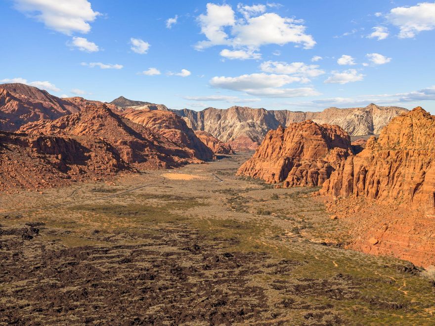 Stunning pad-ready lot in the prestigious Reserve at Entrada featuring an east-facing backyard. Enjoy cool, shaded afternoons and breathtaking sunsets glistening across the red rock cliffs, beautifully contrasted by the surrounding lava fields. The building pad allows for an impressive single-level residence with substantial design flexibility. No deed restrictions, giving you the freedom to choose any HOA approved builder. Contact agent for details on build capacity and design possibilities.