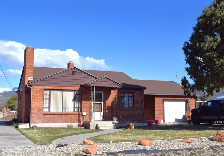 Escape the hustle and bustle of the city with this charming country bungalow.  2 Bedroom, 1 bath.  Bathroom has been recently updated.  Original oak floors add tons of charm. Garage is finished in the inside with  another bedroom, bathroom and kitchenette. Great for guests/bunkroom or an AirBNB. All brick home with newer roof. Amazing corrals and a rustic outbuilding. Bring your horses, cows, chickens or goats! Access the Piute ATV trails from your front door as well as hunting and fishing.