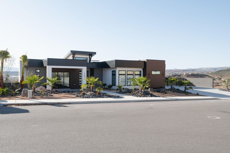 This one hits different. Barely lived in and fully furnished, this modern desert home shows like it's brand new. You've got red rock views for days, a backyard with its own garage entrance perfect for entertaining or turning into a killer game room, and every upgrade you could want. Outside is dialed — pool, spa, pickleball court, and low-maintenance desert landscaping. Inside, it's all high-end: hardwood floors, big windows, waterfall island, hidden pantry, and a layout that just feels right. This is the kind of place that actually lives as good as it looks.