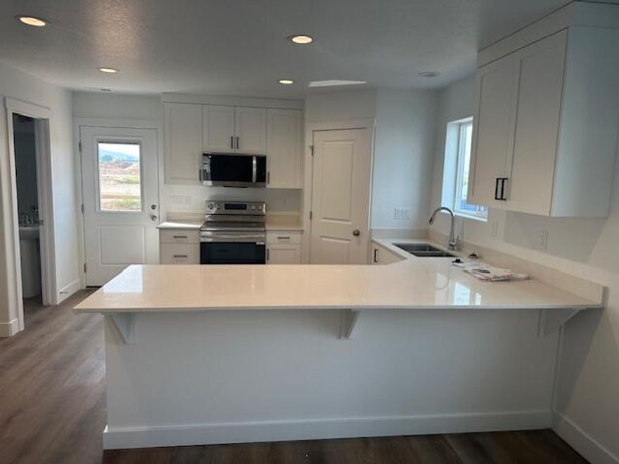 Under construction. Estimated completion date October 2025. Amazing interior-unit townhome by Desert Sage Homebuilders. Here you'll find incredible value at an accessible price point. Enjoy a functional, open floor plan, with a lovely kitchen with painted/stained cabinets, quartz countertops, nice corner pantry, open great room, laundry room, and a powder bathroom on the main level. Upstairs you'll find the primary suite and a second bedroom. The Cedar Breaks community is located in a great area with quick and easy access to I-15. This home would be a great primary residence or investment property! This unit does NOT have a garage, but does have a carport. *All information is deemed reliable but not guaranteed, buyer to verify all..*Photos of similar unit
