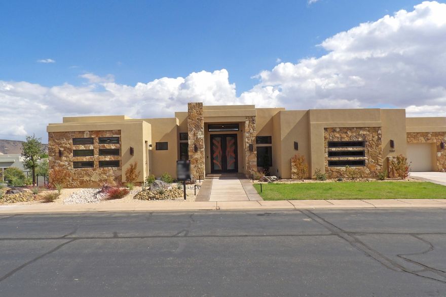 This home is in a gated community. Iron front door, real wood floors throughout the home and wood beams in the great room. Every bedroom is a master suite with a bathroom and walk-in closet. The theatre room has a kitchenette with a serving area. Downstairs has a pocket sliding window door, a laundry room, and a pool bathroom. Pool, Spa and a built-in outdoor grill area. Come see what other things this home has.