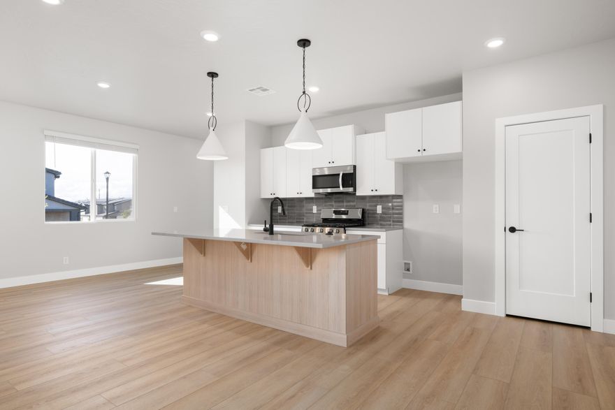 Step into The Sunrise, where versatile living meets spacious comfort. Nestled in Coral Canyon, this end-unit 2 story townhome, with 4 bedrooms and an open-concept design, is bathed in natural light from its abundant windows. Thoughtfully crafted for both relaxation and activities, the home features dual vanities, walk-in closets, and ample storage to keep life stylishly organized. The large great room and central kitchen island create the perfect setting for everyday adventures and memorable gatherings in the welcoming Coral Canyon community.