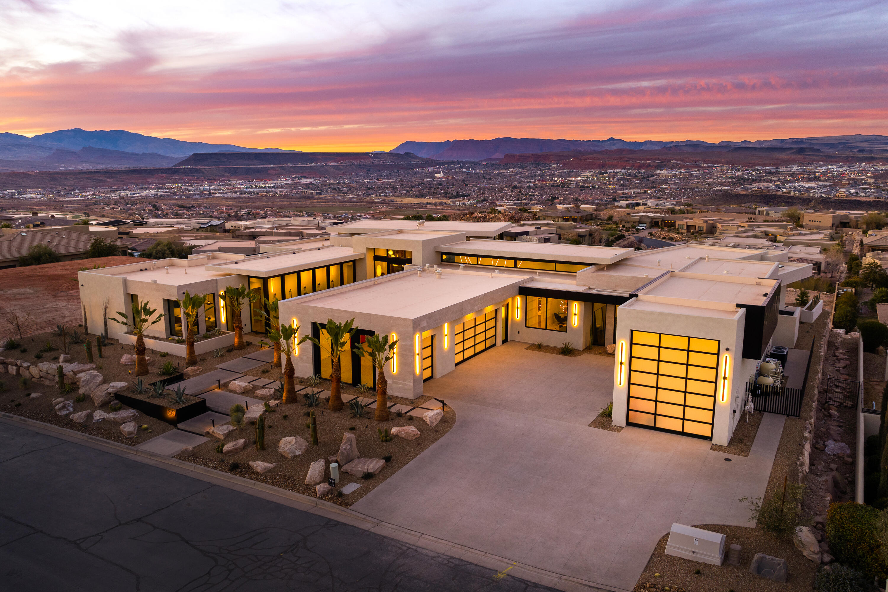 Perched on one of the highest lots in the prestigious gated community of Stone Cliff, On Top of the World is a Baja-contemporary masterpiece that boasts expansive views that stretch beyond the horizon, offering a breathtaking backdrop for everyday living. Inspired by the baja desert, this sleek, contemporary interior showcases a seamless blend of style and functionality, with clean lines, high-end finishes, and abundant natural light. Expansive windows and open-concept living spaces seamlessly merge indoor and outdoor living, making it perfect for entertaining. Enjoy gatherings in the spacious living area, unwind in vibrant outdoor lounges, or host unforgettable evenings in the outstanding Wolf-Subzero kitchen. This is not just a home; it's a lifestyle of luxury and comfort.