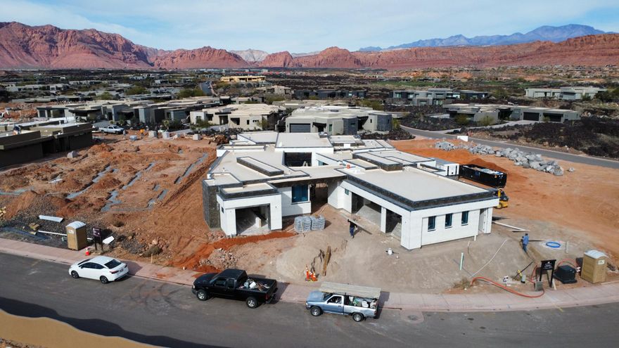 Welcome to this Split Rock custom build that is an exceptional residence in the prestigious Entrada community, offering 4,926 square feet of refined living space. With 5 bedrooms, 5.5 bathrooms, and a spacious 4-car garage, this home blends modern elegance with timeless comfort.

Walls of glass frame the extraordinary red rock and mountain vistas, creating a seamless connection between indoor living and the breathtaking natural surroundings. The open-concept design features expansive living areas, a chef's kitchen with top-tier finishes, and thoughtfully designed spaces for both entertaining and relaxation. Each bedroom offers its own private ensuite, ensuring comfort and privacy for family and guests alike. The primary suite is a retreat of its own, with stunning views and a spa-inspired bathroom
An incredible outdoor living space extends the home's lifestyle to the desert landscapeperfect for relaxing, entertaining, or dining beneath Entrada's signature sunsets. Whether gathering with friends or savoring quiet moments, this home captures the very best of luxury living.