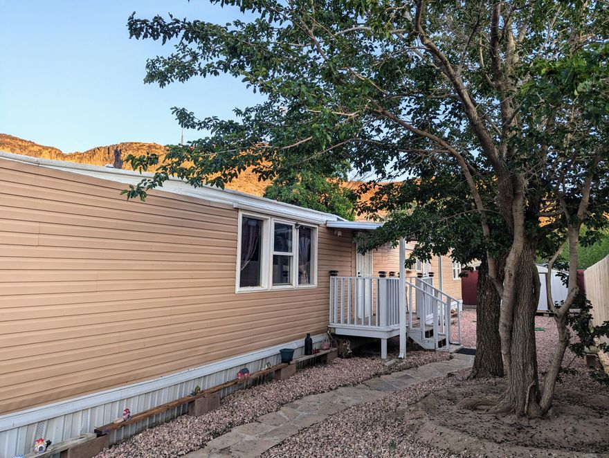 Priced to Sell! Cute mobile home vacant and ready for new owner to occupy! It is an end unit that has a newer wooden fence on one side. The main bedroom has an electric fireplace. The appliances that are shown are included, as well as the shed in the back yard. There is a large Mulberry tree that provides beauty and shade. 2 Parking spots in front. Lot rent is $700/month. Utilities are additional. No land is included. Can be used as a rental. Must pass credit and background check in order to live in Pecan Tree Mobile Home Community. Special financing is available with 20% down.