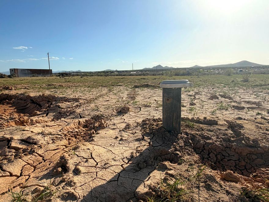 Great opportunity to own a beautiful high-desert 1.25 acre building parcel in Cedar Valley Acres with views of Three Peaks, and 1 acre foot of Water Rights (from WR # 73-4788). There is a well located near the NE corner of the property, drilled in 2026, and a 50/50 Well Agreement will be made with the neighboring parcel #D-0456-0504-0000, also for sale. An electrical transformer is located at the NW property corner. Zoned Residential Single Family with animal rights, an ADU and nightly rentals are allowed. No HOA! Seller may consider a discount for the purchase of both properties together. Storage container will be removed prior to sale.