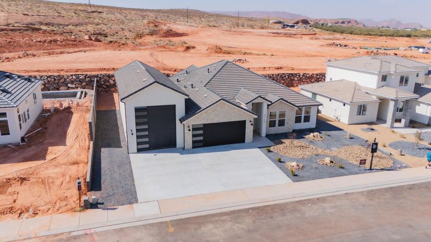 ~ OVERSIZED 52' DEEP RV GARAGE~
Full landscaping included

This stunning home in the sought-after Sand Hollow Village area blends modern comfort with the ultimate recreational lifestyle. 

- Ask about adding a pool-

One of the home's standout features is the massive 52-FOOT DEEP RV GARAGE (12' wide x 14' tall door)! Inside, you'll find an open-concept layout with LUXURY FINISHES, spacious bedrooms, and LARGE BACKYARD WITH ROOM TO ADD A POOL! 

This property comes equipped with premium SMART HOME features including 3 wired in insecurity cameras and a door bell camera. Just minutes from Sand Hollow Reservoir, Sand Hollow Golf Course, the sand dunes, and Zion National Park, you're surrounded by year-round adventure - boating, biking, hiking, off-roading, and more. 

Contact listing agent for PRIVATE SHOWINGS & ADDITIONAL INCENTIVES!