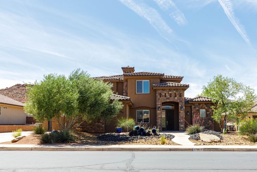 Seller is willing to contribute $10,000 toward Buyer's closing costs at successful Closing with a full price offer. Nestled among stunning red rock hills, this beautifully designed home offers comfort, flexibility, and easy living. With no HOA and Dixie Power, ownership is budget-friendly. The versatile floor plan includes two spacious gathering
rooms, up to 6 bedrooms (or 5 plus an office), and a main-level guest suite with en-suite bath--ideal for guests or
multi-generational living. The gourmet kitchen features attractive upgrades and opens to an inviting living area anchored
by a cozy fireplace, perfect for everyday living and entertaining. Enjoy low-maintenance xeriscape landscaping, a
tranquil water feature, and a large covered patio. Conveniently located near parks, pickleball courts, and outdoor recreation. Owner/Agent. 
Second Garage was used as a workshop with 4 220 amp outlets and a 30 amp outlet for welding/RV.