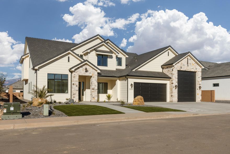 Brand new, beautiful home built by B1 Builders. Detailed interior with impressive finishes. Lots of storage, butler's pantry, 2 laundry rooms, guest bedroom on the main level and an RV garage.  RV Garage measurements - about 50' deep, 17' wide with a 13'x14' garage door.  Full landscape, and block walls on three sides included.