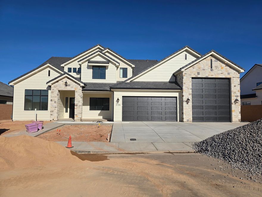 Brand new, beautiful home built by B1 Builders. Detailed interior with impressive finishes. Lots of storage, butler's pantry, 2 laundry rooms, guest bedroom on the main level and an RV garage.  RV Garage measurements - about 50' deep, 17' wide with a 13'x14' garage door.  Full landscape, and block walls on three sides included.