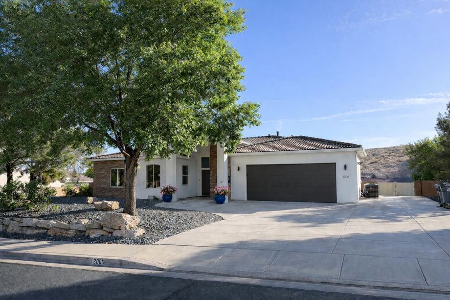 Welcome to this beautiful, clean, modern home in the Knolls at Little Valley! A desirable neighborhood with no HOA. Situated on a spacious .48 acre lot with stunning red rock and city views with RV parking in addition to the 2-car garage. Inside, you'll find an open and inviting floor plan with plenty of natural light, a well-appointed kitchen, and shiplap walls with stunning finishes. The basement with a second kitchen, theatre room, living room and bathroom creates space for guests or investment options with enterainment. 2 new  HVAC units (upstairs & basement) with warranty and brand new water heater with 5 year warranty. From the walkout basement you join a fully landscaped backyard against the mountain. Located just minutes from parks, hiking and biking trails, shopping, dining, and top-rated schools, this home truly has it all.