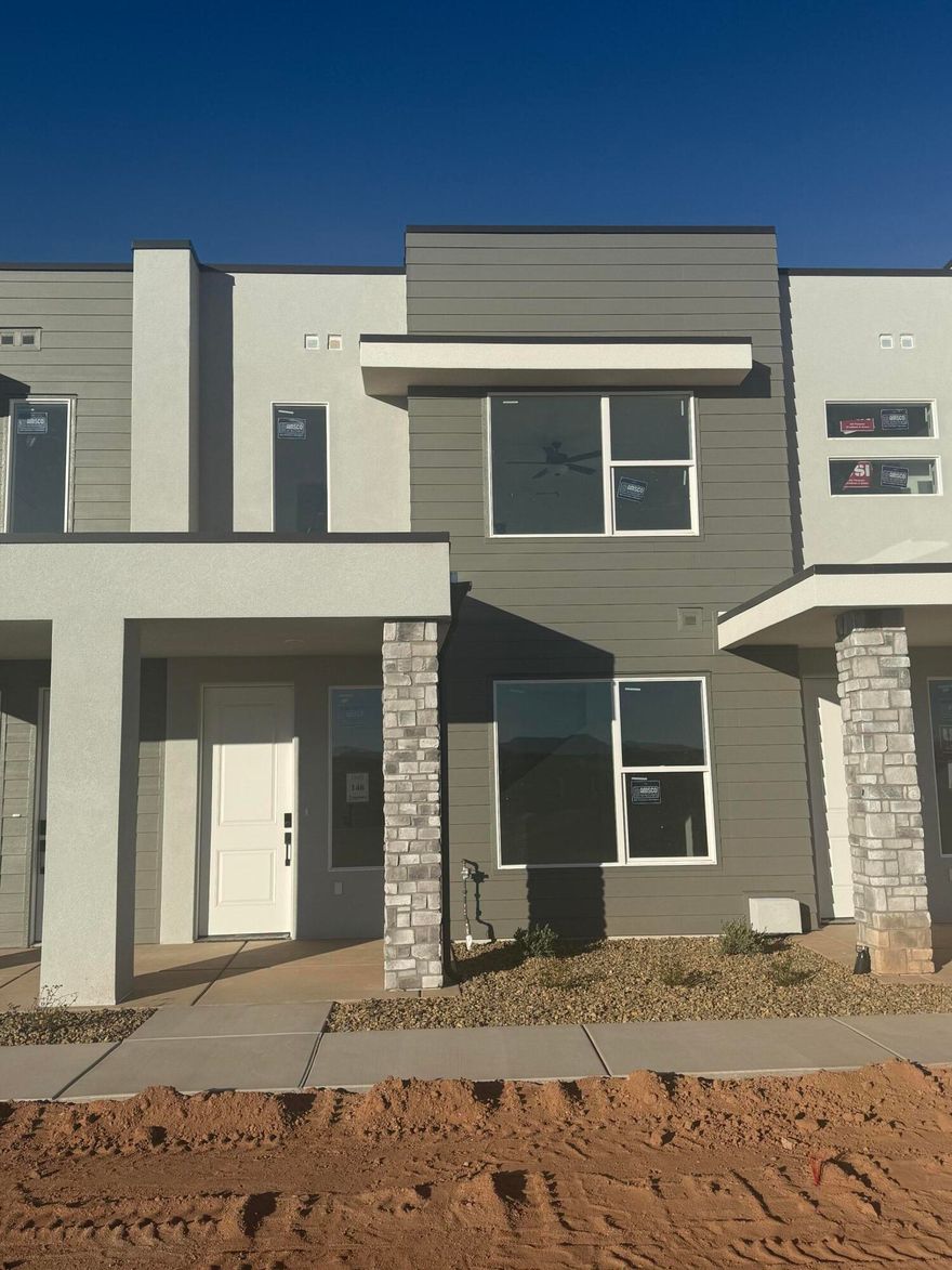 This inviting 3-bedroom, 2.5-bathroom townhome boasts a prime location just moments away from Zion Shores surf park, Warner Valley, and Sand Hollow making it perfect for outdoor enthusiasts and adventure seekers. The spacious living area flows seamlessly into a well-appointed kitchen complete with stainless steel appliances. The generous primary bedroom is complete with an en-suite and walk in closet. Two additional bedrooms provide plenty of space for guests, a home office, or hobbies and they share a stylishly designed full bathroom. A convenient half-bath is located on the main level. Step outside to enjoy your own covered patio where you can enjoy views of Warner Valley and Pine Valley.