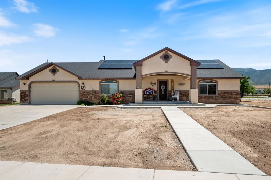 Discover this beautiful home tucked away in a quiet neighborhood, offering peace, space, and stunning views. Sitting on nearly half an acre, there's plenty of room to add a workshop, garage, or garden separate from the fully fenced backyard, perfect for pets, entertaining, or relaxation. Inside, you'll appreciate the spacious open floor plan with soaring vaulted ceilings, a large kitchen featuring granite countertops, abundant storage, and a convenient walk-in pantry. The primary suite opens directly onto the large, covered patio, making it easy to enjoy the panoramic mountain views. An unfinished basement with installed electricity and plumbing offers additional potential for customization, while a workshop space in the garage, complete with ventilation, adds even more functionality to this well-maintained and welcoming home. Buyer to verify all information, deemed reliable, however buyer to verify all info including utilities, rental restrictions, and HOA information if applicable.