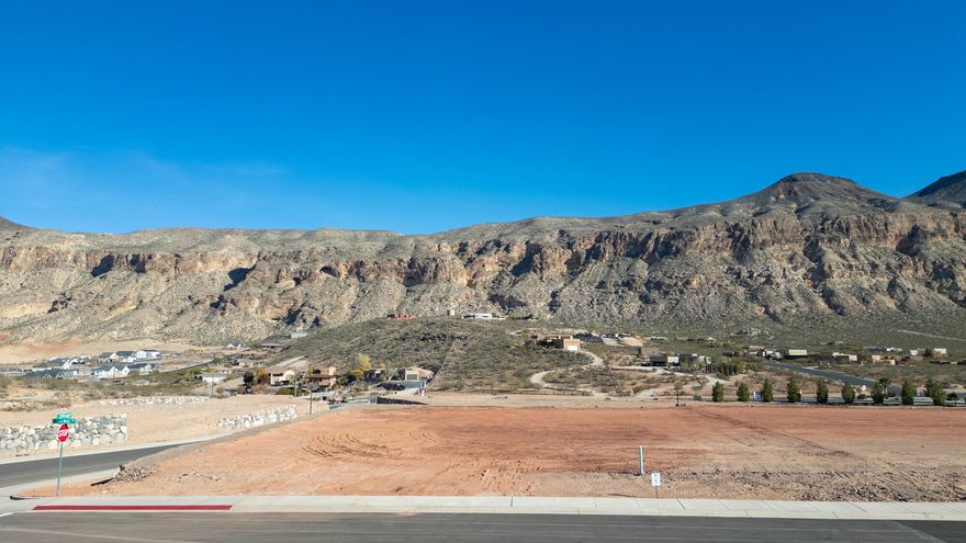 Build your dream home on this spacious 0.43-acre lot in the highly desirable Views at Hurricane Cliffs community. Surrounded by Southern Utah's iconic red rock landscapes, this premium homesite offers breathtaking panoramic views and a peaceful setting while still being just minutes from shopping, dining, and everyday conveniences in Hurricane.
Outdoor enthusiasts will love the close proximity to world-class recreation including hiking, biking, golf, and off-roading trails, along with easy access to nearby destinations like Zion National Park and Sand Hollow State Park.
Builder incentive included: Purchase this lot and receive a $25,000 builder incentive when you build with one of the community's approved builders. These trusted professionals are known for their quality craftsmanship and expertise in creating custom homes that complement the surrounding landscape.
Don't miss this opportunity to secure a premium lot in one of Southern Utah's most scenic settings and bring your vision to life at The Views at Hurricane Cliffs.
