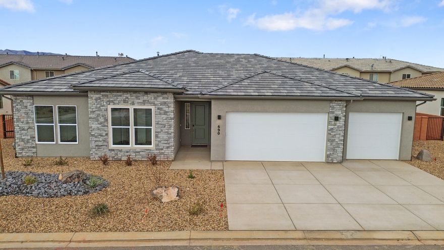 Interest Rates as low as 3.99% available through our preferred lender. Surrounded by beautiful desert and red rock scenery. Fire Lake at Ivins Reservoir, Unity Park, and Kayenta Art Village are very close by. A short drive away are Tuacahn Ampitheater, Snow Canyon State Park and Black Desert Golf Course and resort. This floorplan has a sunroom extension off the large kitchen. Enjoy a gourmet kitchen, quartz countertops throughout, a fireplace in the great room, and a shady covered patio. The 3rd car garage bay is double deep so there is room for all the cars and toys.