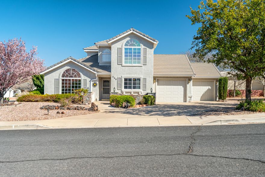 Located in the Santa Fe Hills subdivision in Hurricane, this well-kept home sits on a massive lot with mature vegetation and large shade trees that give the property privacy and space rarely found at this price point. The home features a 2-car garage and a clean, well-maintained interior that has clearly been cared for over the years. Inside, the layout offers great functionality and is a perfect canvas for anyone looking to add their own modern updates and build instant equity. Upstairs features an office area with it's own balcony. Also included is RV Parking with full RV Hookups! Positioned just off State Street, the location provides quick access to shopping, schools, parks, and everyday conveniences while still sitting in an established neighborhood. If you're looking for space, a great location, and an opportunity to make a home your own without breaking the bank, this Santa Fe Hills property is one you'll want to see.