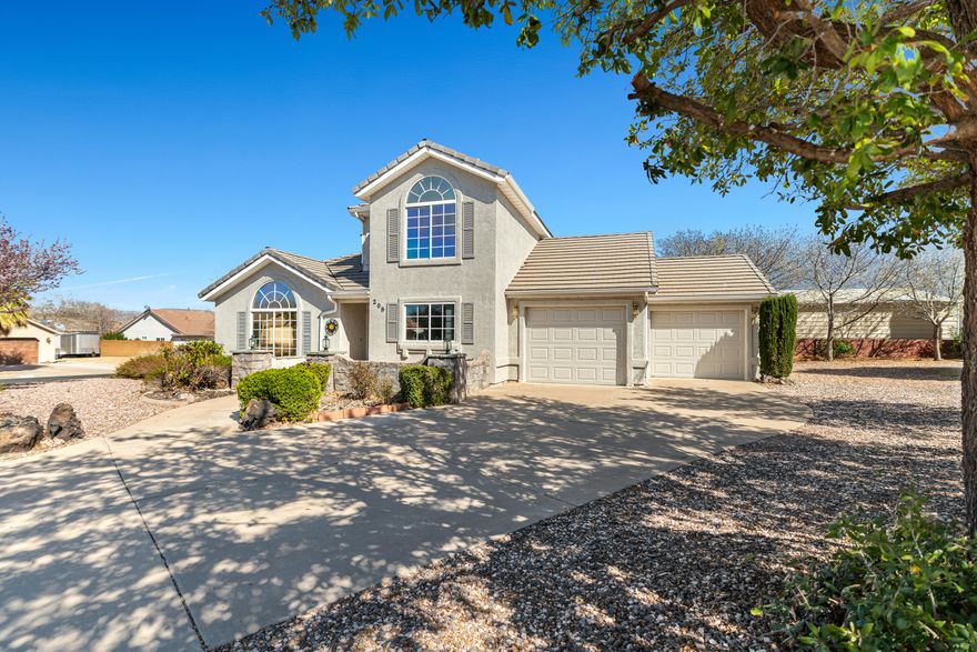 Located in the Santa Fe Hills subdivision in Hurricane, this well-kept home sits on a massive lot with mature vegetation and large shade trees that give the property privacy and space rarely found at this price point. The home features a 3-car garage and a clean, well-maintained interior that has clearly been cared for over the years. Inside, the layout offers great functionality and is a perfect canvas for anyone looking to add their own modern updates and build instant equity. Positioned just off State Street, the location provides quick access to shopping, schools, parks, and everyday conveniences while still sitting in an established neighborhood. If you're looking for space, a great location, and an opportunity to make a home your own without breaking the bank, this Santa Fe Hills property is one you'll want to see.
