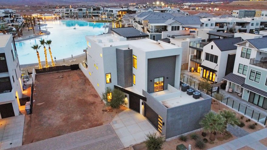 Wake up to glass smooth water, white sand beaches, and relax at night watching panoramic sunset views across the lagoon. This premier lagoon front residence is positioned directly on the water with unobstructed views in one of the most sought after locations in St George. Designed as a true luxury vacation retreat, the home features extensive upgrades, high end finishes, and designer furnishings throughout. The exceptional waterfront placement and thoughtful design have contributed to a proven track record as one of the highest performing vacation rentals in all of Desert Color. Offered as a 1/4 fractional ownership, this is a rare opportunity to enjoy luxury lagoon front living while also benefiting from outstanding rental performance.