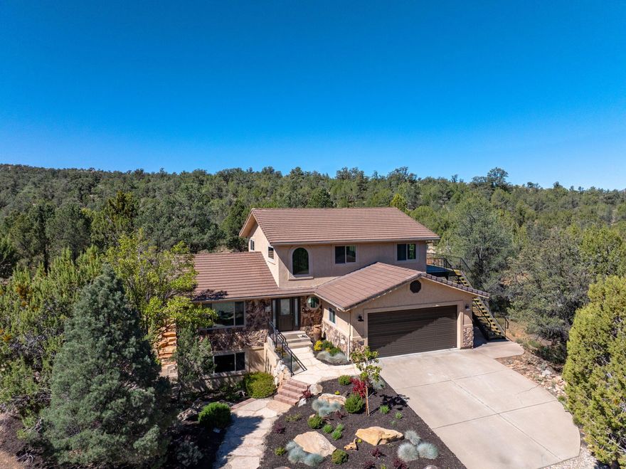 Tucked deep in the pines of Dammeron Valley, this fully remodeled home offers a rare blend of comfort, quality, and true ''backyard wilderness'' living. Set on a 1-acre lot backing directly to BLM land and adjacent Red Mountain Wilderness, you'll enjoy immediate access to over 18,000 acres of pristine public land, perfect for hiking, riding, and exploring right from your doorstep. Inside, vaulted ceilings, abundant natural light, and expansive windows showcase the home's impressive views and create a bright, open feel. Thoughtfully updated throughout, the home features multiple living spaces across three levels. The spacious primary suite is filled with natural light and features an en-suite bath with dual vanities, a separate soaking tub, and an oversized closet with a convenient sink and plenty of storage space. Built with quality in mind, the home features solid 2x6 construction anchored into bedrock, geothermal heating and cooling for year-round efficiency, and a well-appointed garage with epoxy flooring, built-ins, and a utility sink. Step outside to peaceful patios and a view deck designed to take in the quiet, private surroundings. Additional highlights include horse privileges (up to 2 horses), a finished lower level with flexible living space, and zoning that preserves the area's rural, low-density feel. This is more than a home, it's a private retreat where nature, comfort and space come together. Association dues $135 annually Fire SSD dues $550 annually