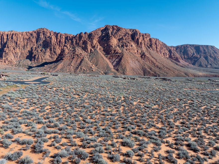 Last remaining developer-owned lot in the beautiful Posovi area of Kayenta. Dramatic Red Mountain views surround this 1.47 acre lot, located at the top portion of the neighborhood.  Enjoy seasonal waterfalls, nearby BLM land, and hiking trails on this rare and secluded cul de sac lot.