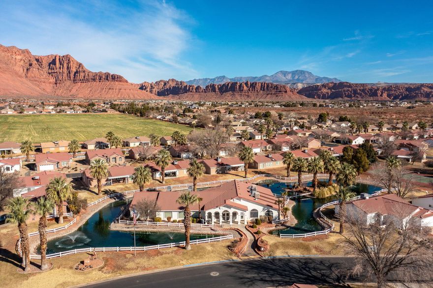 WAKE UP TO SPECTACULAR RED MOUNTAIN VIEWS. Excuse our dust, neighborhood is converting to desert landscape.Enjoy the relaxing life-style of Padre Lakes with Pickleball court out your backdoor., Close to Snow Canyon and entertaining ''Broadway in the Desert,''our own Tuacahn.  Boat and kayak at nearby Gunlock Lake. Plus Bike trails and hiking. Near shopping and banking and  medical.
    Beautifully upgraded home, flooring, lighting, granite counters and more.
    Dues include water inside and out, yard care, large clubhouse with activities, indoor pool great for winter
months, home insurance, sewer and garbage. Non-rental community.