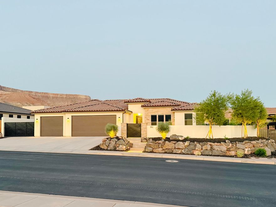 Quality built home with everything you are looking for! Bring all of your toys as this home boasts a 4 car garage w/240 volt plug in garage for EV charging, plus side yard RV Parking. Beautiful kitchen featuring an oversized island with cabinets beneath, gorgeous custom cabinetry, revers osmosis system, drink fridge, 2 sub zero fridge drawers & butler's pantry. Master suite w/ soaker tub & walk in shower, linen closet, dual vanities, sky light & walk in closet with custom cabinetry & shelving. Natural gas generator w/ auto transfer switch. Gated front courtyard. Fully fenced backyard with oversized back patio & pergola, perfect for entertaining. Other upgrades include epoxy garage floor, soft water system, garage storage room w/ shelving, plumbing for garage sink & central vacuum system. Located just 25 mins from downtown St. George and 30 mins to Zion National Park. Buyer to verify all information.