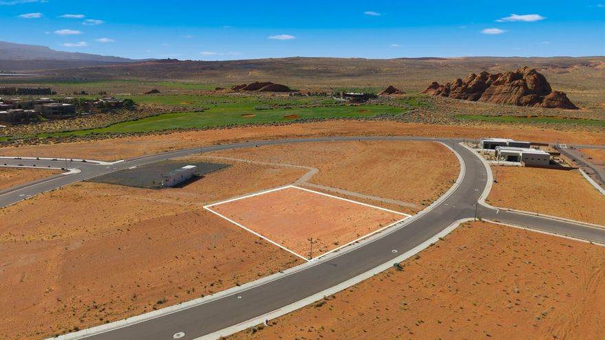 Build your dream home on this exceptional 0.51-acre homesite in The Estates at Sand Hollow Resort. Perfectly positioned with an east-facing backyard, you'll enjoy shaded afternoons and evenings while taking in Southern Utah's beautiful desert landscape and colorful sunrise views to start your day.
With generous space for a custom residence, resort-style pool, outdoor living, and seamless indoor-outdoor design, this homesite provides the canvas to create a home that complements both lifestyle and luxury. Surrounded by championship golf, adventure, and endless recreation, this is more than a homesite, it's an opportunity to create your own desert retreat.
HOA benefits include front and backyard landscape maintenance giving owners more time to enjoy what matters most. Additional ownership perks include discounted green fees at Sand Hollow Golf Course, along with exclusive benefits and resort amenities that enhance the ownership experience.
Whether your ideal day includes golfing on a nationally recognized championship course, boating at Sand Hollow Reservoir, exploring nearby dunes and trails, or simply relaxing in your own private retreat, the possibilities are endless. Bring your own builder or choose from one of the community's premier builders and create a home that reflects your vision and lifestyle.