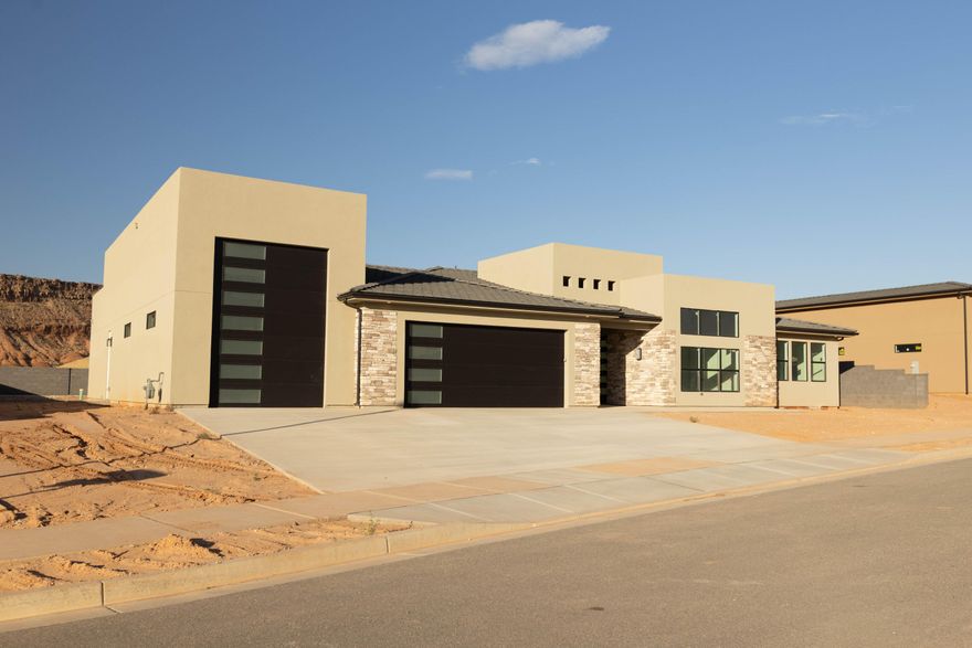 Brand-new modern rambler by Next Level Homes in Frontier. Nearly 3,400 sq ft with 2 guest suites w/ private entrances, RV garage, large great room w/ glass pano door, huge flat yard ideal for a pool with red rock views. Corner lot with extra RV parking.