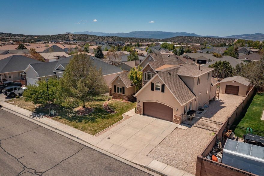 Located in the desirable Mesa Hills neighborhood, this 6-bedroom, 3.5-bathroom home, over 4,000 SqFt, 0.24 acres, built 2002, 2 car garage, and 3 levels offers plenty of space, comfort, and convenience. Inside, you'll find 3 large living areas (2 on the main and 1 in the basement), amazing functional layout, and modern touches throughout that make the home both welcoming and practical. Some of the features include high ceilings in the main floor, 2x fireplaces, laundry room with utility sink, hardwood floors, and so much more. The walk-out basement adds valuable extra living space with endless possibilities for a family room, kitchenette, game room, guest suite, home gym, or entertainment area. Outside, the fully landscaped yard provides great curb appeal and a relaxing outdoor setting to enjoy year-round. Incredible large deck, planters, and built-in trampoline. The home includes a detached garage/workshop offers additional parking, storage, or the perfect space for hobbies and projects.


Cedar City is one of the most beautiful cities in the high mountains of Southern Utah. At over 5,000 feet of elevation, it is home to Southern Utah University and the Shakespeare Festival, as well as some amazing restaurants. As part of Southern Utah, you will experience a lifestyle like no other. The area features nearby internationally recognized mountain biking trails, road cycling, hiking, golf courses, national parks such as the Grand Canyon, Zion, & Bryce, national moments, Dixie national forest, reservoirs, & some of the most iconic desert landscapes in the world. Less than an hour away from Brian Head Ski Resort, there is no doubt that this is a fun place to live and play.


All information herein is deemed reliable but is not guaranteed. Buyer is responsible to verify all listing information, including square feet/acreage, to the buyer's own satisfaction.