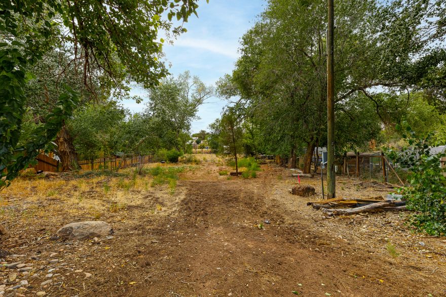 This parcel in Virgin, just minutes from Zion National Park, offers a rare opportunity to create a residence surrounded by natural beauty. The lot includes mature trees, open space ready for development, and panoramic views of the surrounding hills and skies. While a portion of the property lies within the floodplain, there are conventional, standard methods to comply with floodplain zoning—solutions that are straightforward and not expected to create costly complications.

The setting delivers a calm, spacious atmosphere with convenient access to nearby amenities. Utilities are close by, adding to the site's readiness for development. Whether you're looking to build soon or hold as an investment, this property offers flexibility and long-term potential. With its combination of natural features and utility access, it's an ideal foundation for your next chapter in Southern Utah.